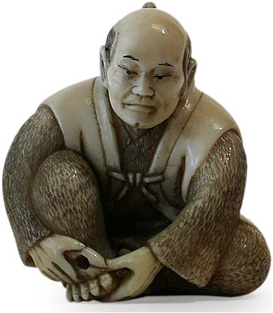 Man Cutting Toe Nail Netsuke