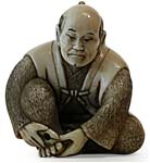 Man Cutting Toe Nail Netsuke