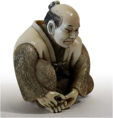 Man Cutting Toe Nail Netsuke