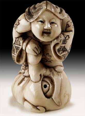 Okame on Tengu Nose Netsuke
